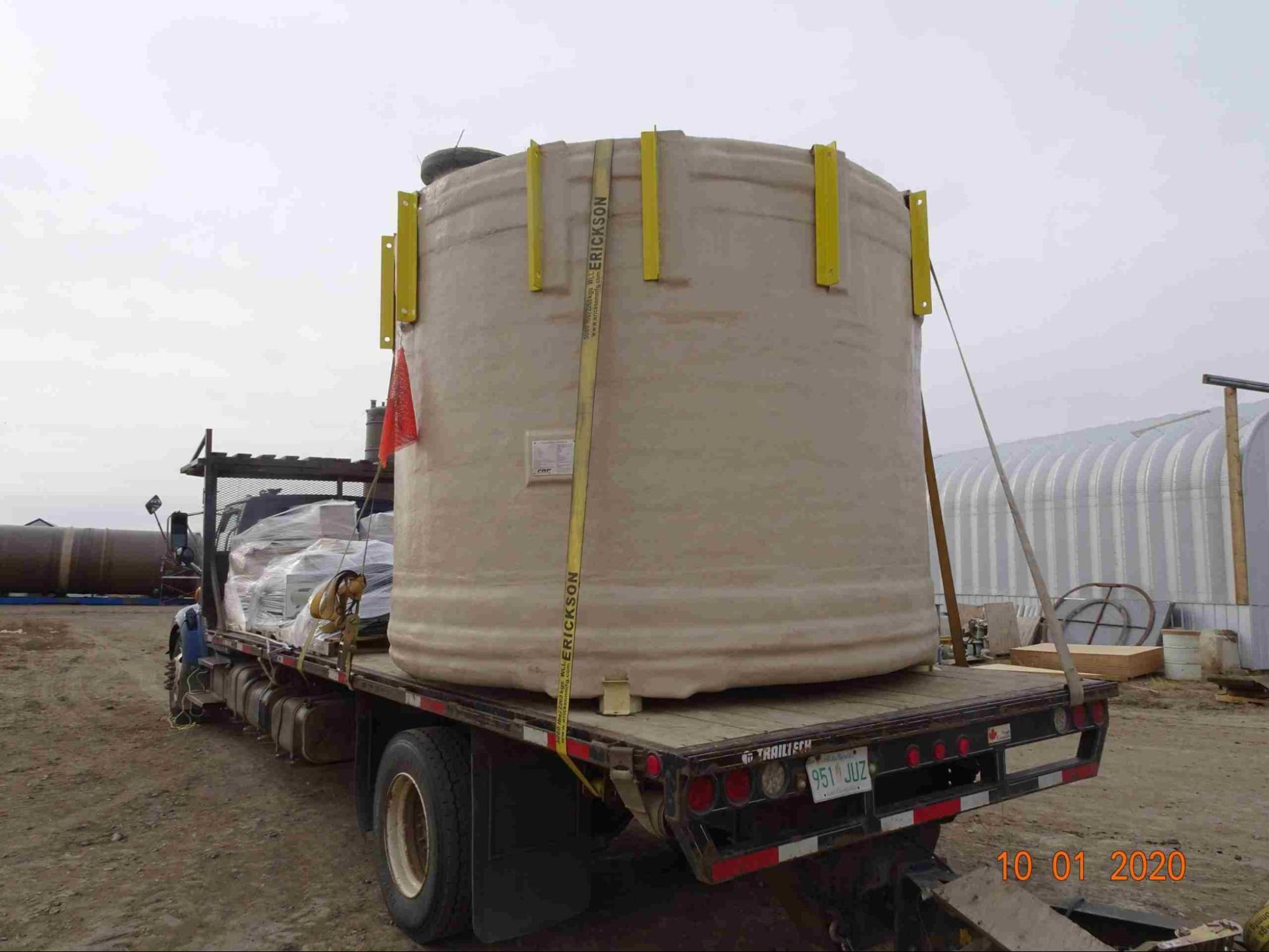 A fiberglass tank was tied and covered safely in a trailer truck.